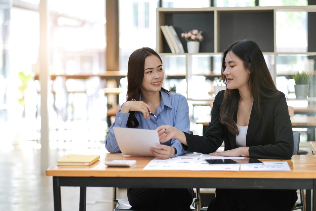 Asian business adviser meeting to analyze and discuss the situation on the financial